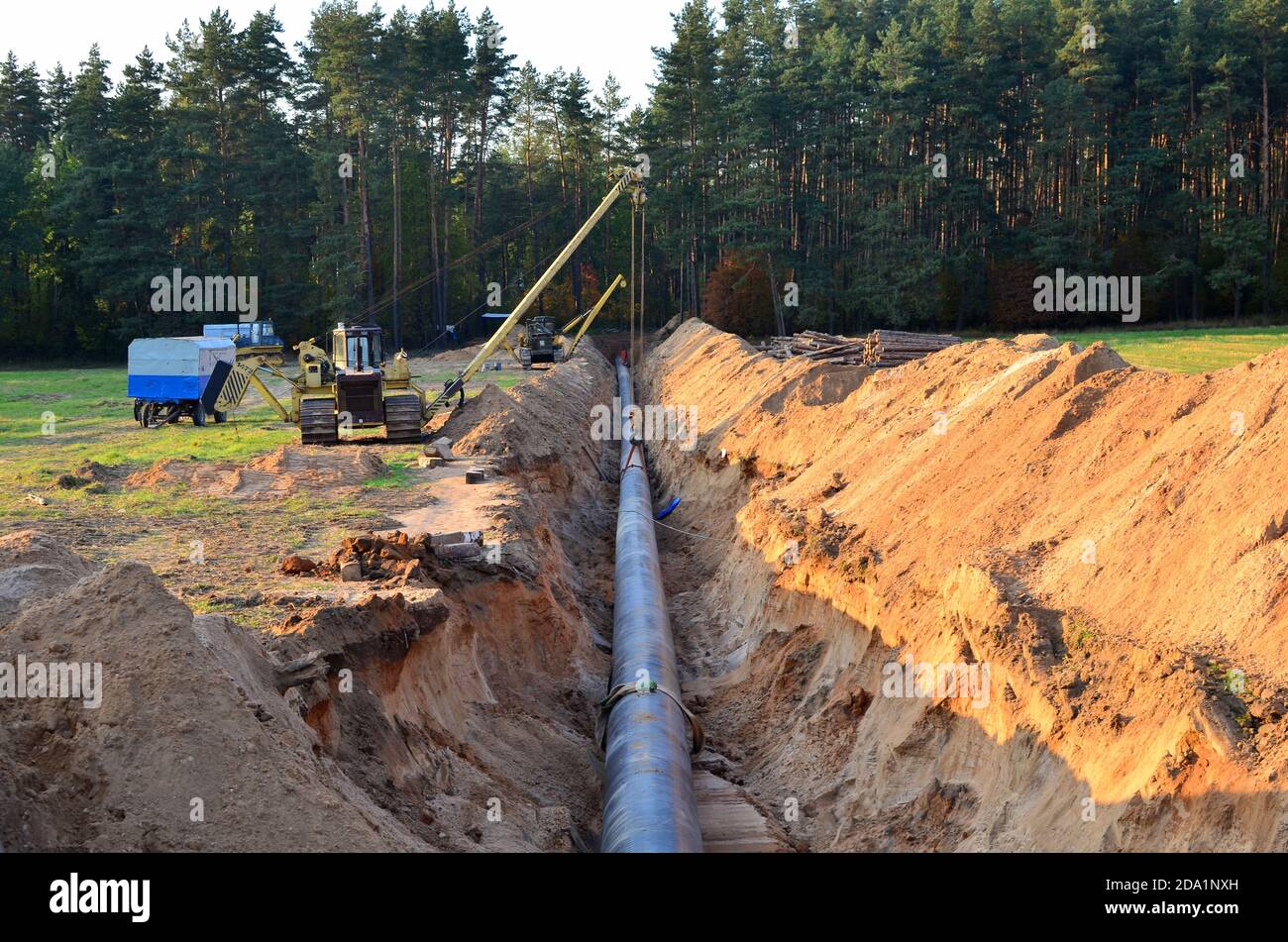 Natural gas pipeline construction work. A dug trench in the ground for ...