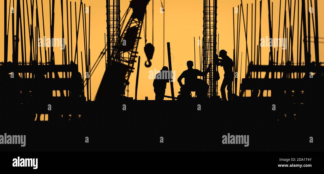 construction worker silhouette on the work place Stock Photo