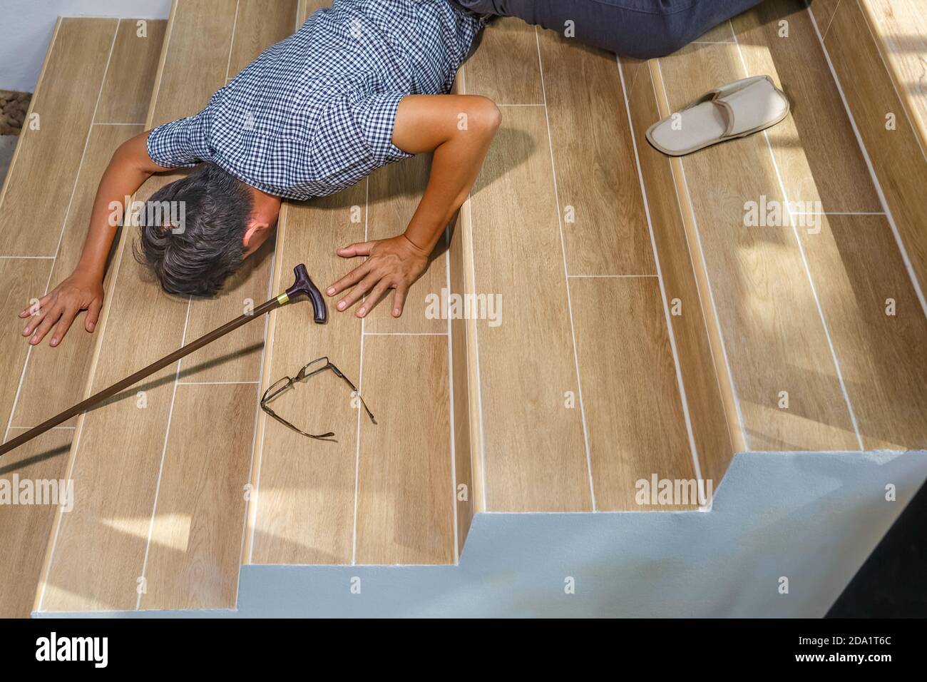 Senior man with stick falling down stair Stock Photo Alamy
