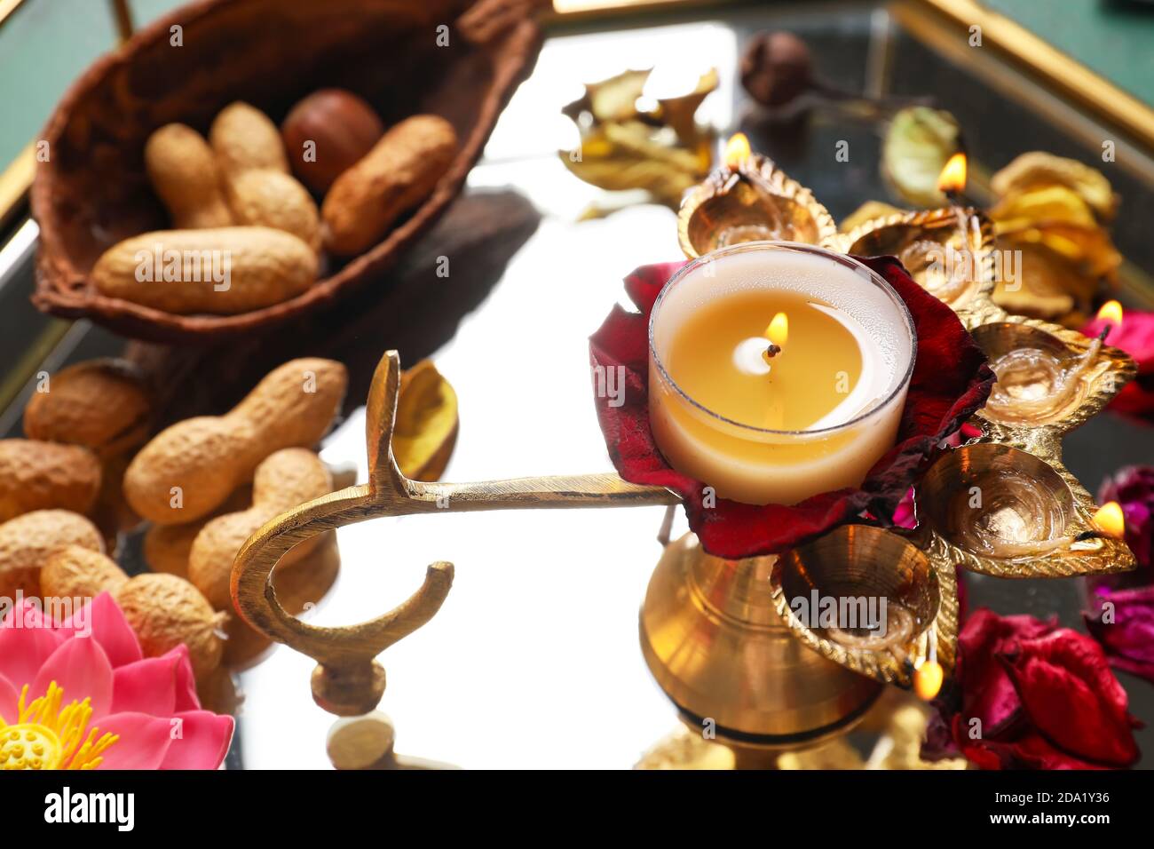 Tray with diya lamp and nuts for celebration of Divaly, closeup Stock Photo