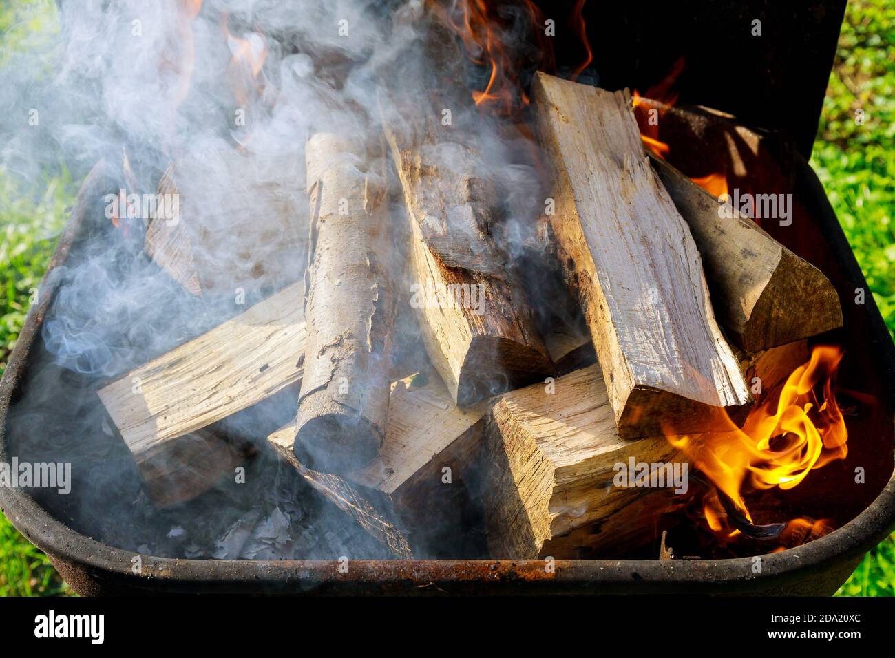Grill outdoor with firewood and smoke for making barbecue Stock Photo ...