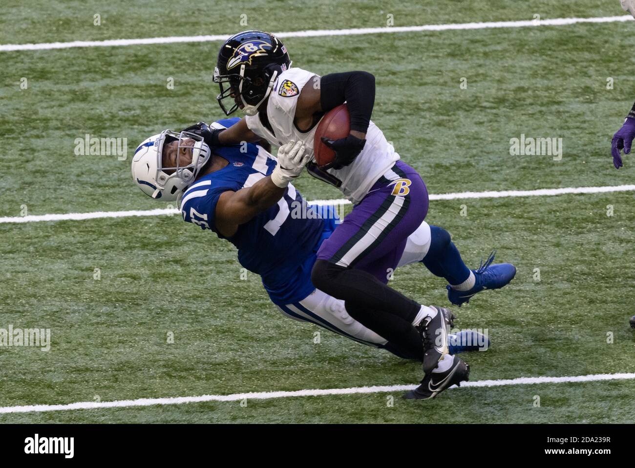Indianapolis, Indiana, USA. 8th Nov, 2020. Baltimore Ravens wide receiver James Proche (11) stiff-arms Indianapolis Colts strong safety Khari Willis (37) after catching a pass during the game between the Baltimore Ravens and the Indianapolis Colts at Lucas Oil Stadium, Indianapolis, Indiana. Credit: Scott Stuart/ZUMA Wire/Alamy Live News Stock Photo