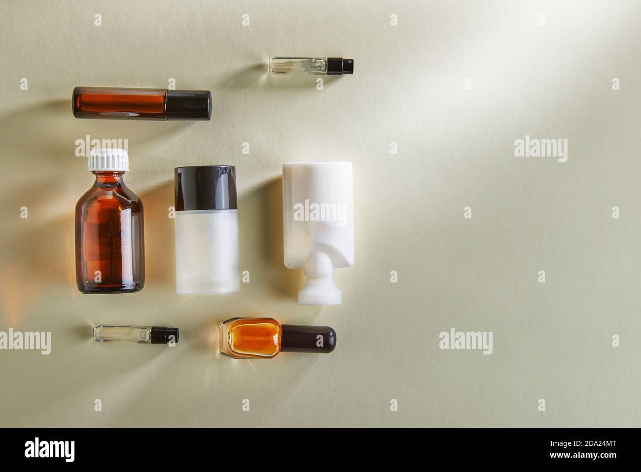Variety of blanks for hand cream, perfumery, shower gel, bottles without labels on a white background with shadows. Flat lay Stock Photo