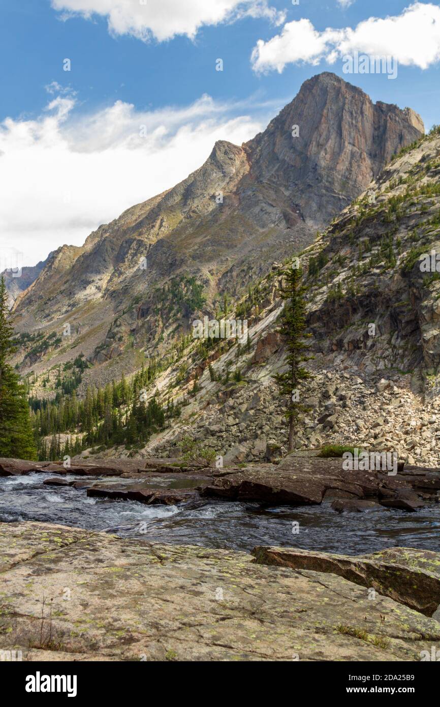 Mountain landscape with East Rosebud creek in the foreground and an unnamed peak in the background. Stock Photo