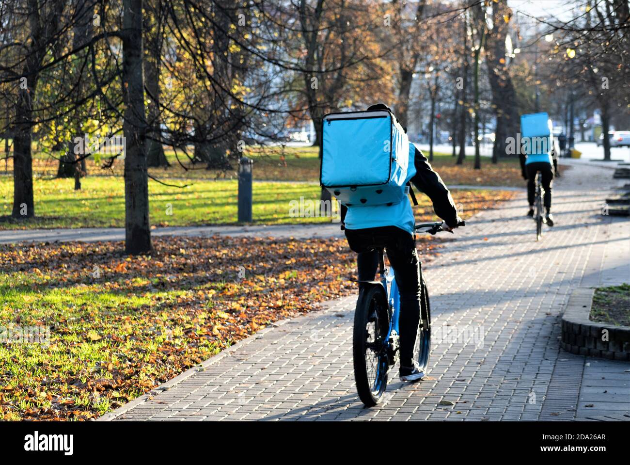 Riders with bike delivering food, online food ordering and delivery service that takes orders via a mobile app during Covid or Coronavirus time Stock Photo