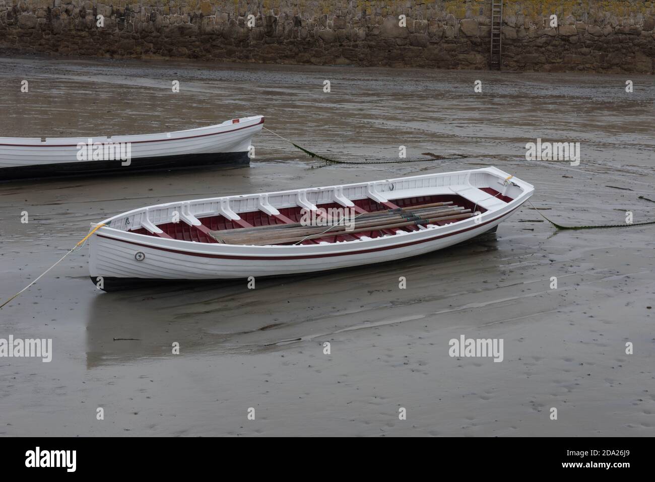 Cornish Pilot Gig Rowing Boat Moored in the Harbour of St Michael's Mount in Rural Cornwall, England, UK Stock Photo