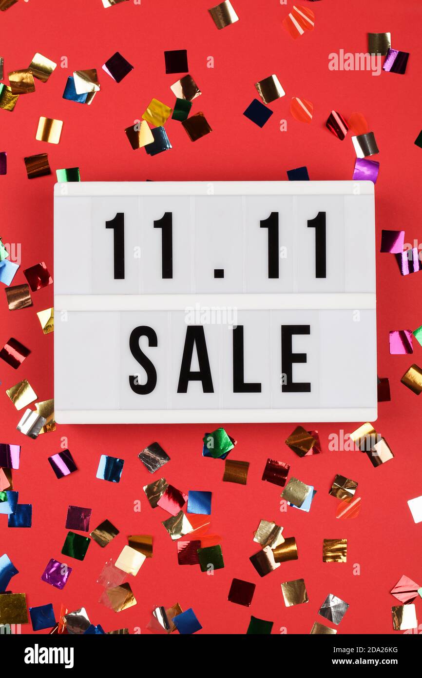 https://c8.alamy.com/comp/2DA26KG/1111-sale-text-on-white-lightbox-on-red-background-with-confetti-online-shopping-singles-day-sale-concept-top-view-copy-space-2DA26KG.jpg