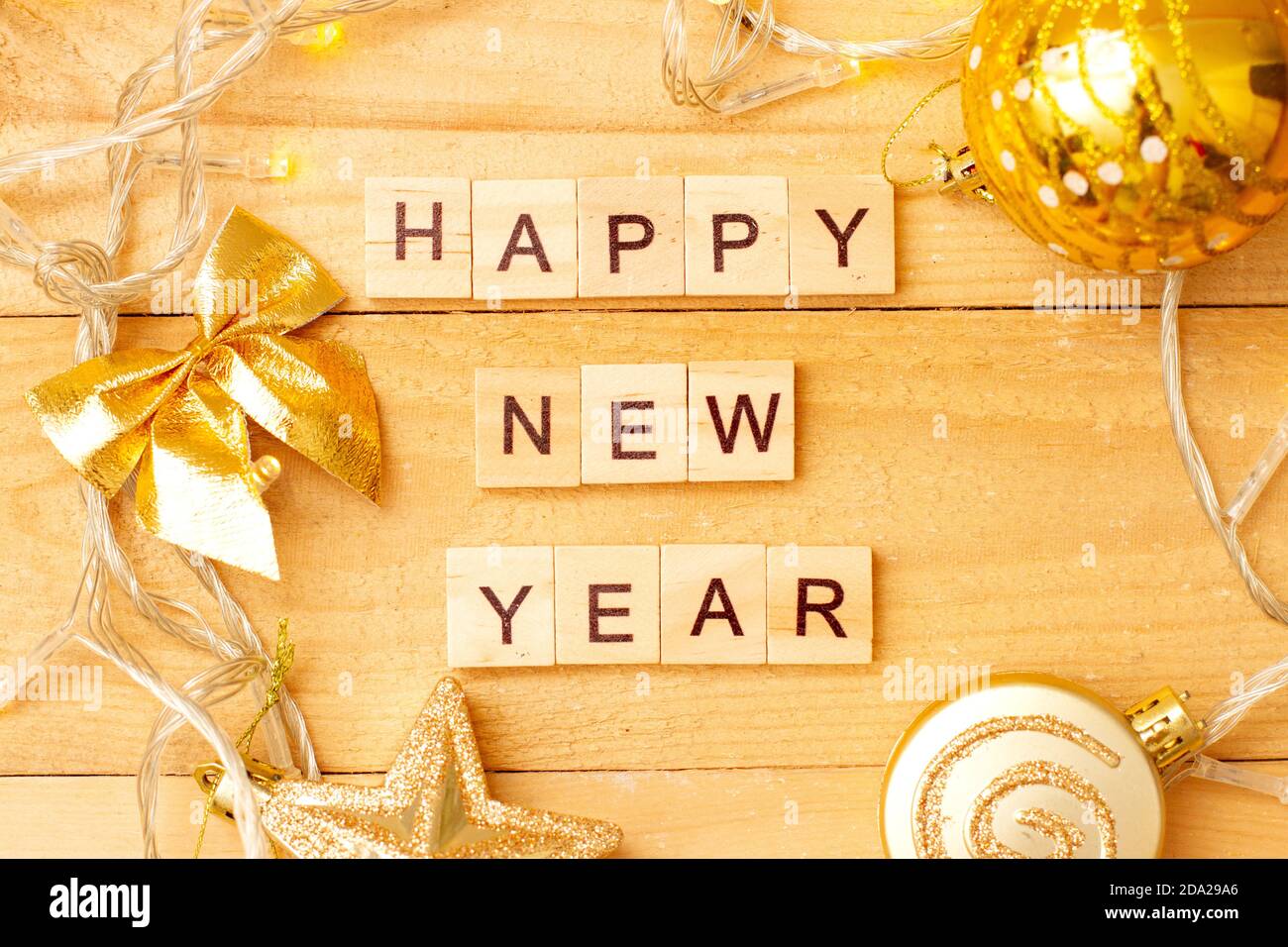 HAPPY NEW YEAR made from wooden cubes with decoration for Chistmas Stock Photo