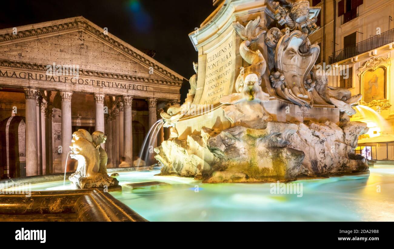 A long exposure night scene of the Fontana del Pantheon in the Piazza della Rotonda, in front of the landmark Roman Pantheon. Stock Photo
