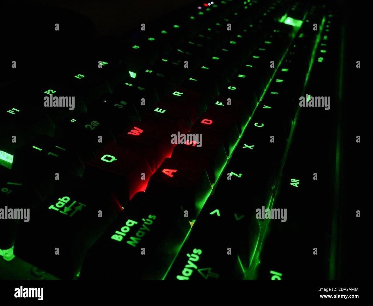 WASD keys closeup in a gaming keyboard with glow lights effects of