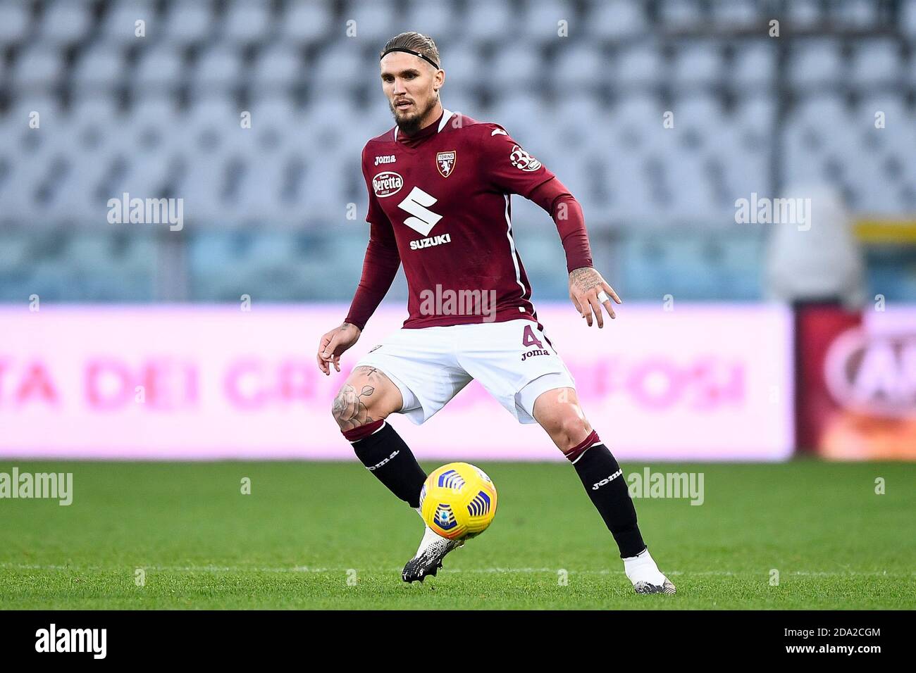 Santa Cristina Gherdeina, Italy. 24 July 2021. Lyanco Vojnovic (R) of Torino  FC competes for the ball with Emanuele Bocchio of SSC Brixen during the  pre-season friendly football match between Torino FC