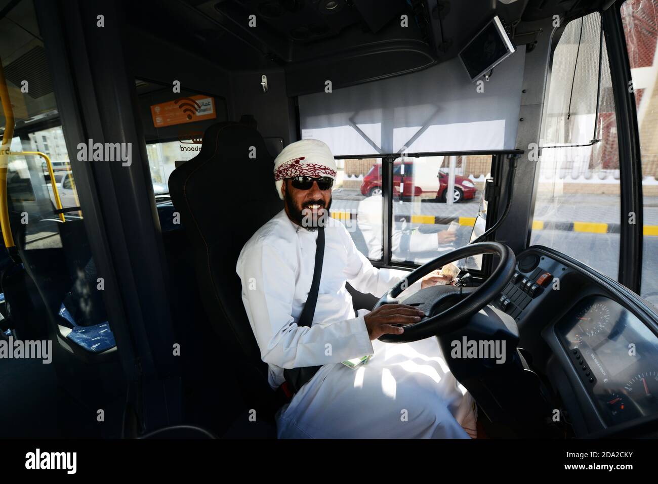 A friendly Omani bus driver in Muscat, Oman. Stock Photo