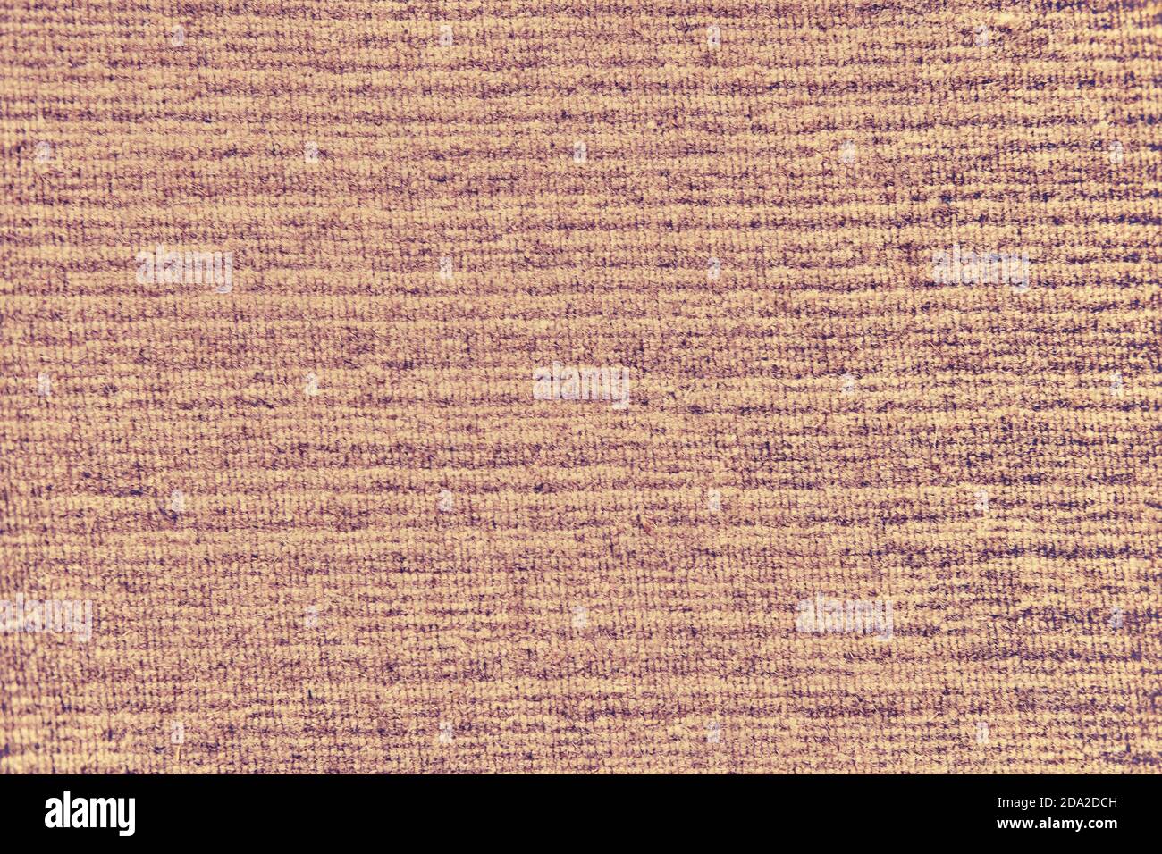 Background of an old worn carpet, texture with a brown pattern Stock