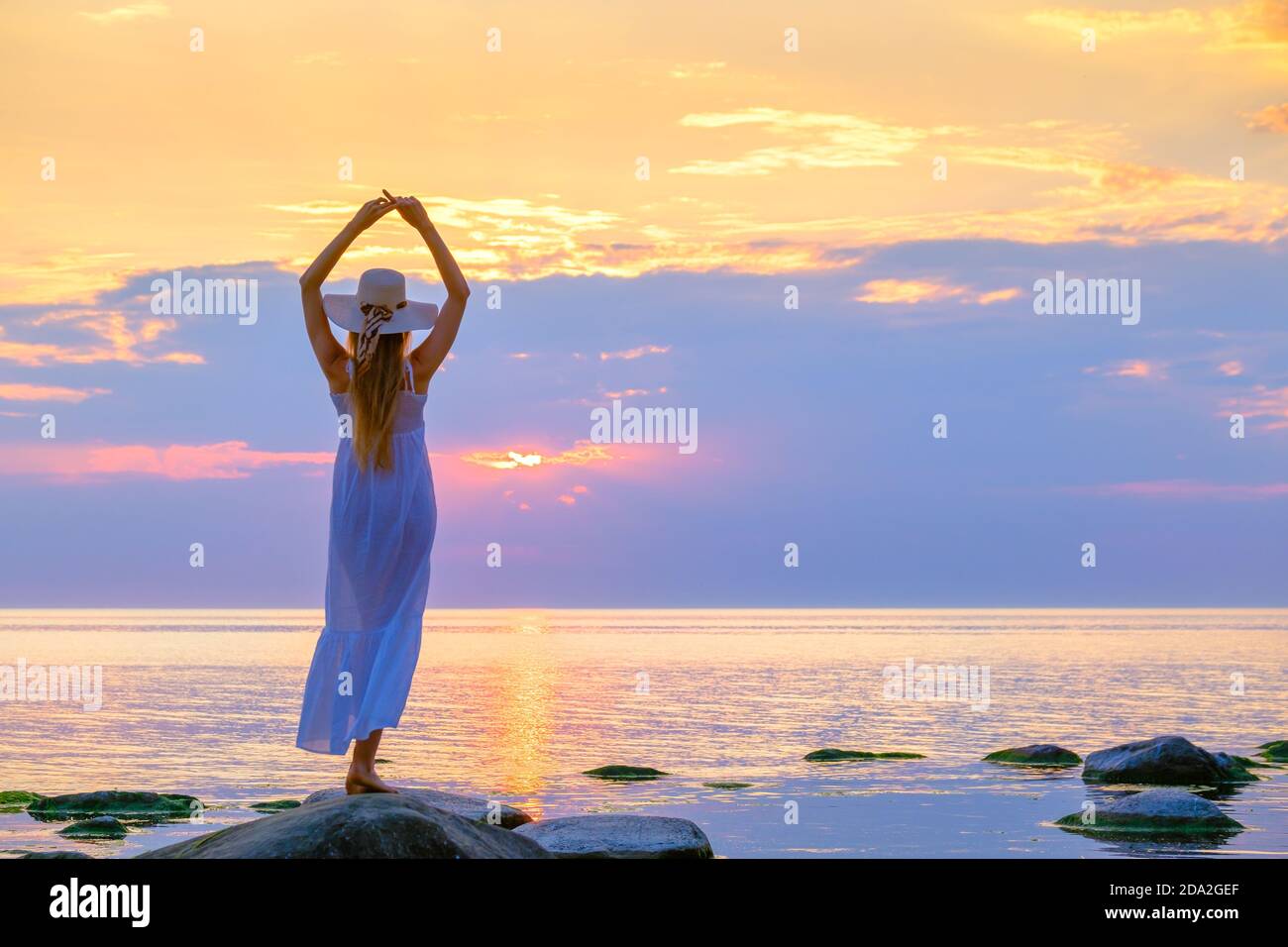 Woman standing in the sea hi-res stock photography and images - Alamy