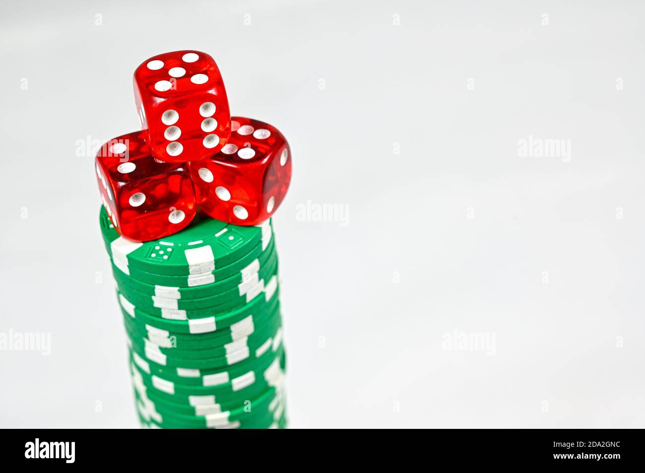 dice on a stack of poker markers Stock Photo Alamy