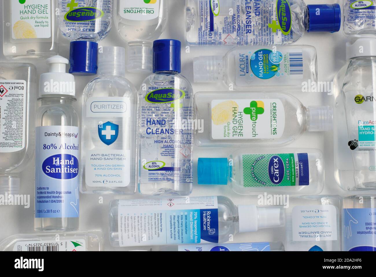 Hand sanitizer. Selection of plastic bottles containing hand sanitiser with varying alcohol content. UK Stock Photo