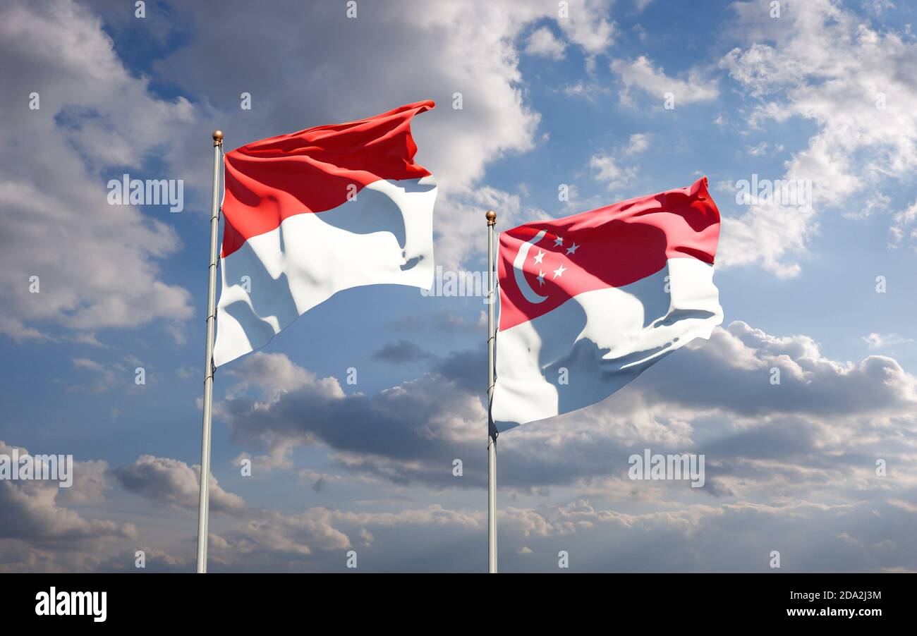 Beautiful national state flags of Indonesia and Singapore together at the sky background. 3D artwork concept. Stock Photo
