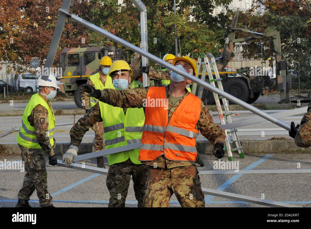 Milan, November 2020, Italian Army, units of NRDC (NATO Rapid Deployable Corps) mount a drive-trough structure for the collections of swabs for the diagnosis of Covid-19 virus in a subway parking area. Stock Photo