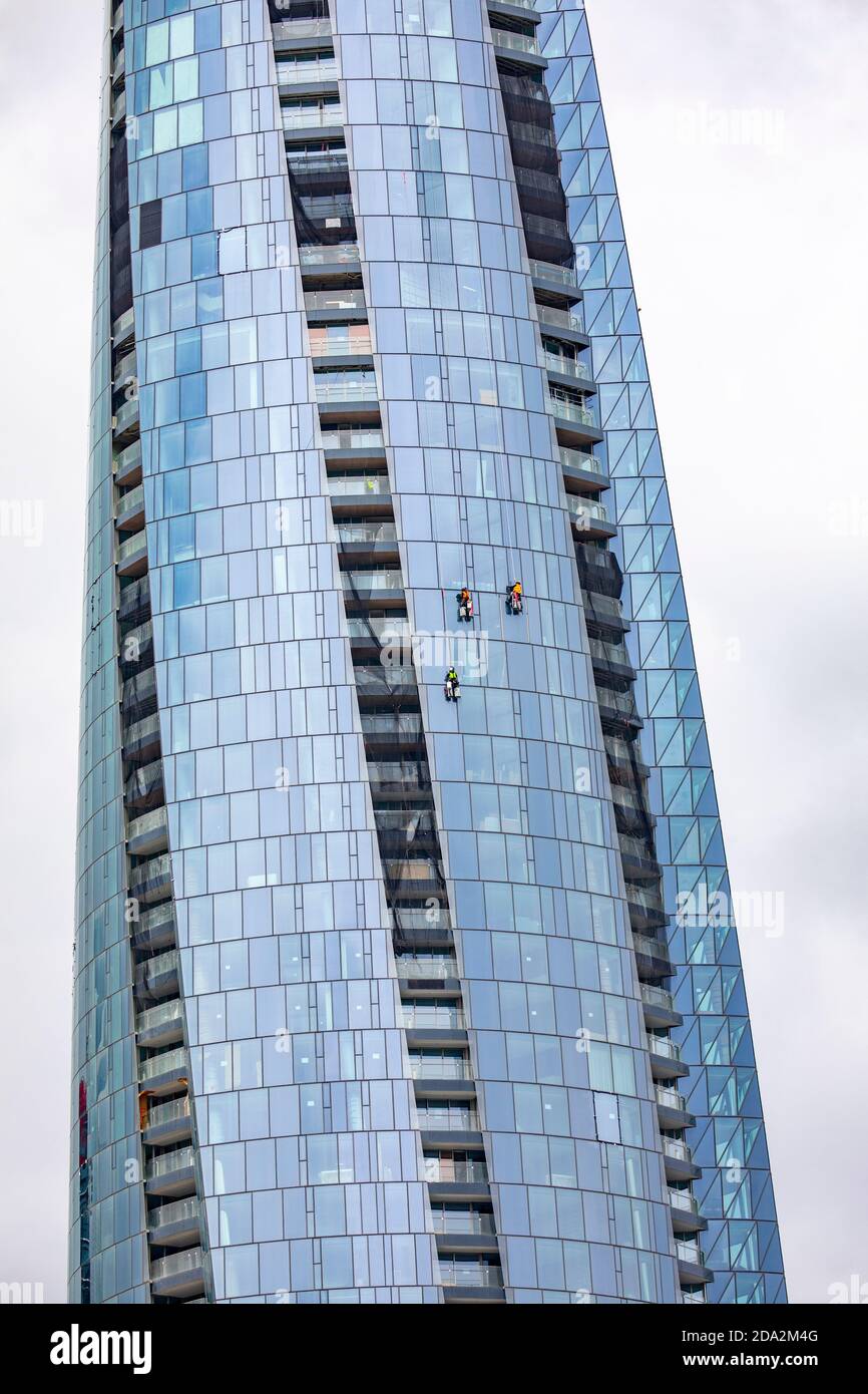 Workers at height cleaning the external facade of the skyscraper Crown Casino at Barangaroo in Sydney,Australia Stock Photo