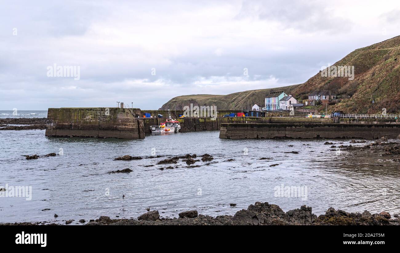 Fishing boats in the harbour at Burnmouth, the first village in Scotland after crossing the English border into Berwickshire in the Scottish Borders Stock Photo