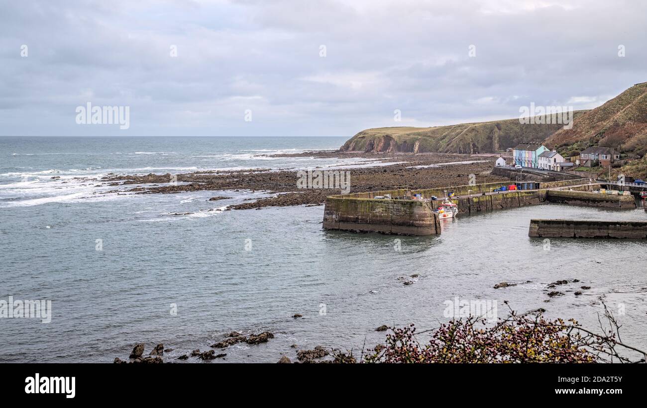 Fishing boats in the harbour at Burnmouth, the first village in Scotland after crossing the English border into Berwickshire in the Scottish Borders Stock Photo