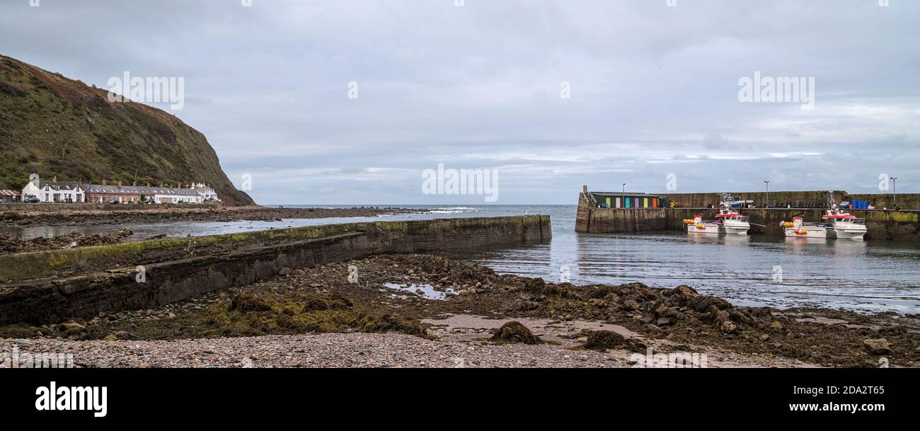 Fishing boats in the harbour at Burnmouth, the first village in Scotland after crossing the English border into Berwickshire in the Scottish Borders Stock Photo