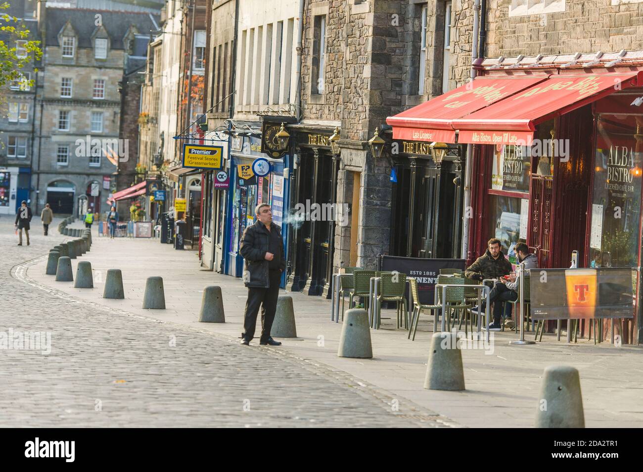 Quiet scenes on Edinburgh's Grassmarket as the tier system is officially brought in today of the severity of the restrictions. Edinburgh is under a tier 3.  Credit: Euan Cherry Stock Photo