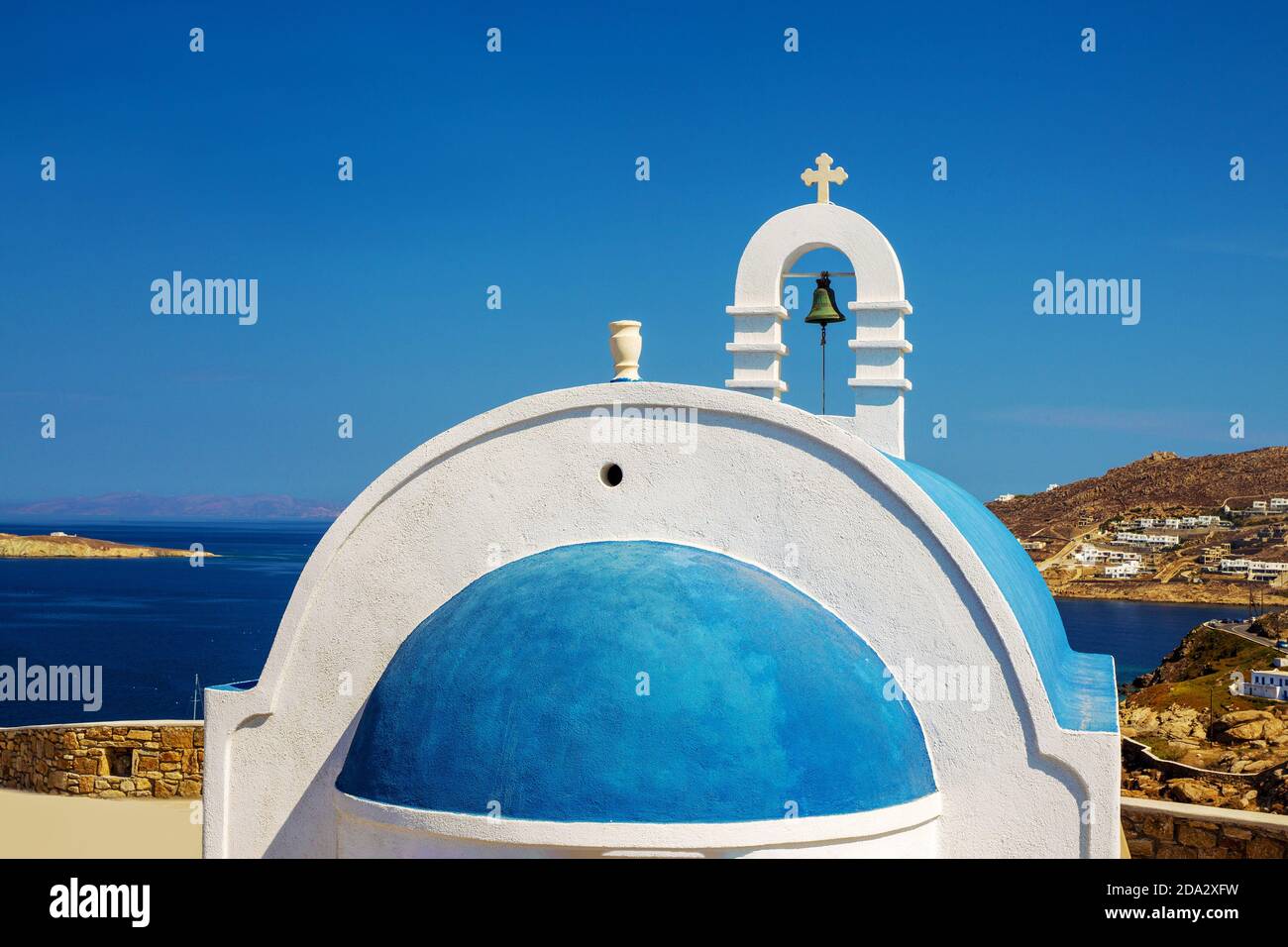 Christian church with dark blue domes of white color against the