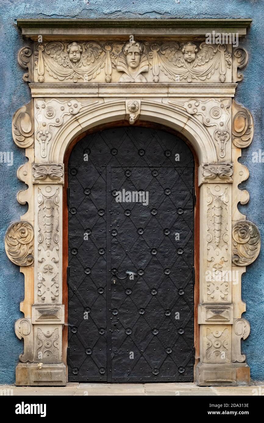 Old iron door entrance to the medieval house in Gdansk old town, Poland. Stock Photo
