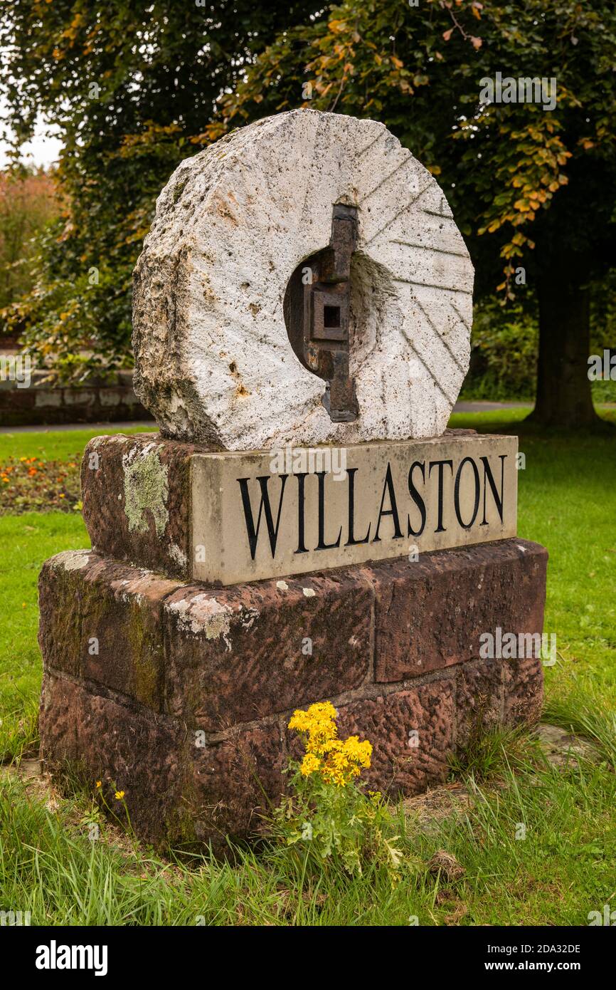 UK, England, Cheshire, Willaston, Village Green, sign with grindstone from village windmill Stock Photo