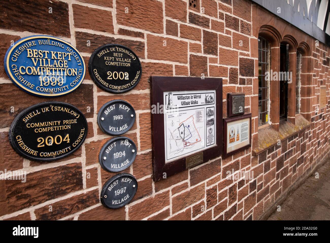 UK, England, Cheshire, Willaston, Green, Best Kept Village plaques on Village Hall wall Stock Photo