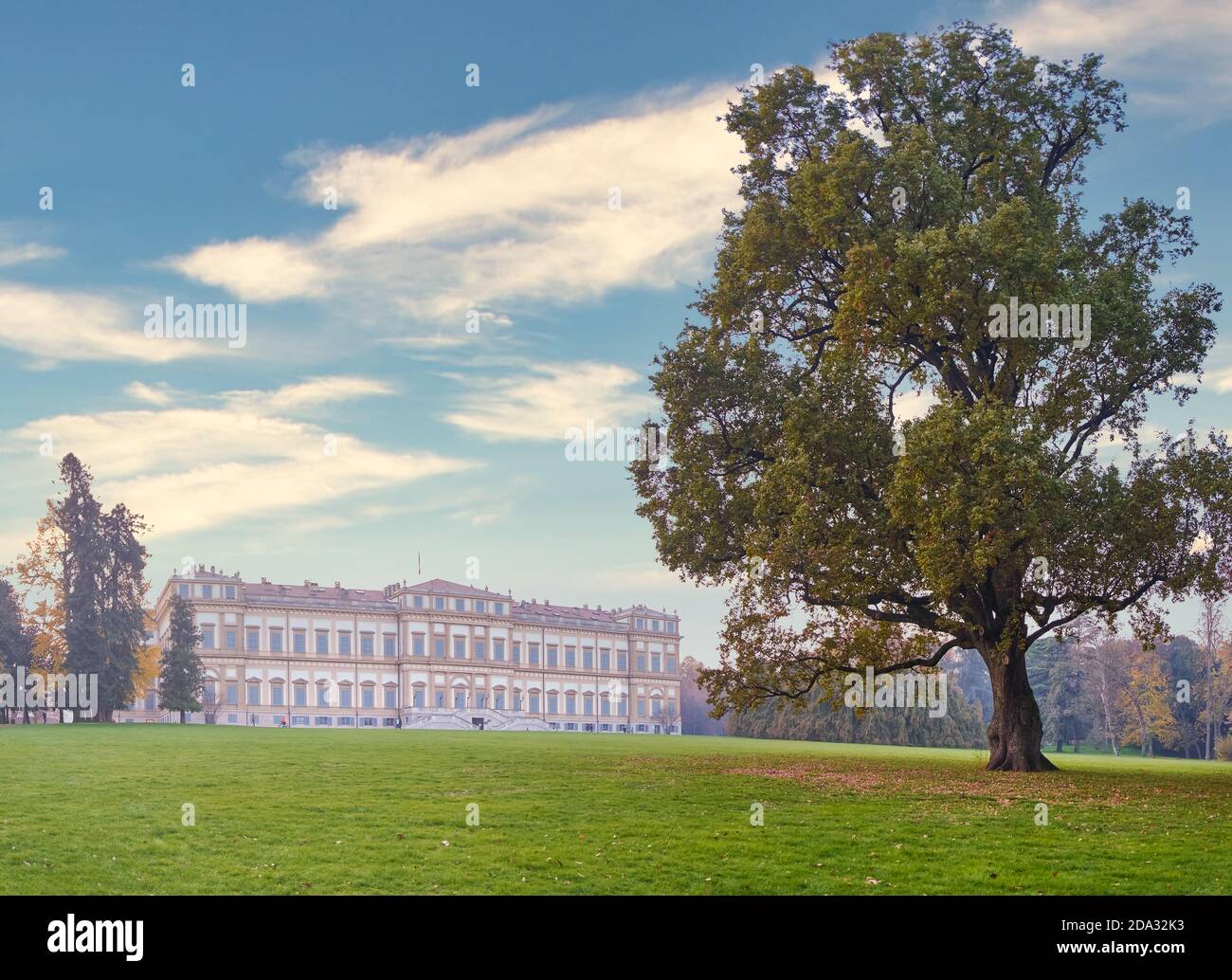 The historic Villa Reale of Monza, Italy surrounded by magnificent tree during a wonderful fall day Stock Photo