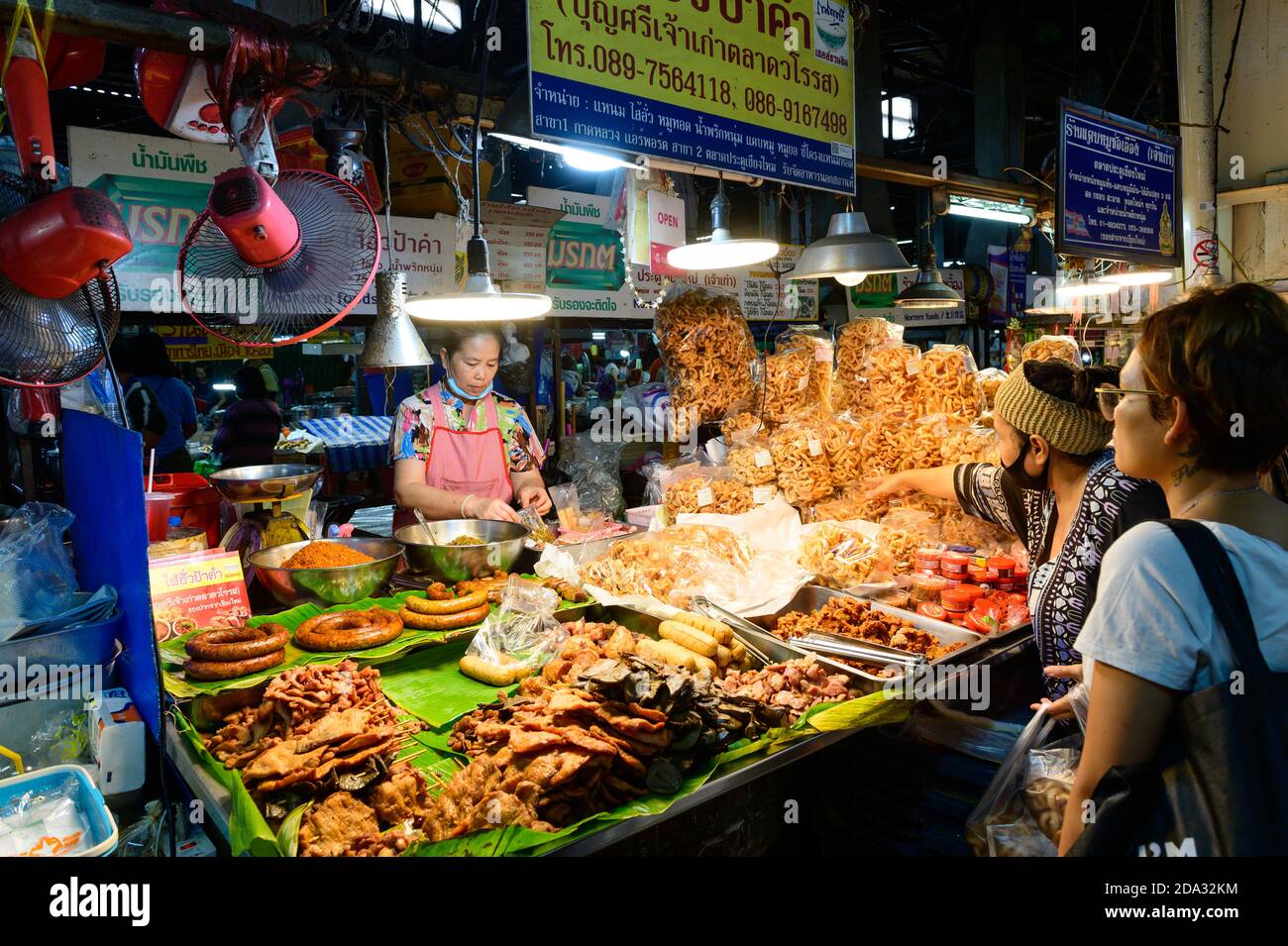 Unidentified woman sales sausages in Chiang Mai Gate market Stock Photo