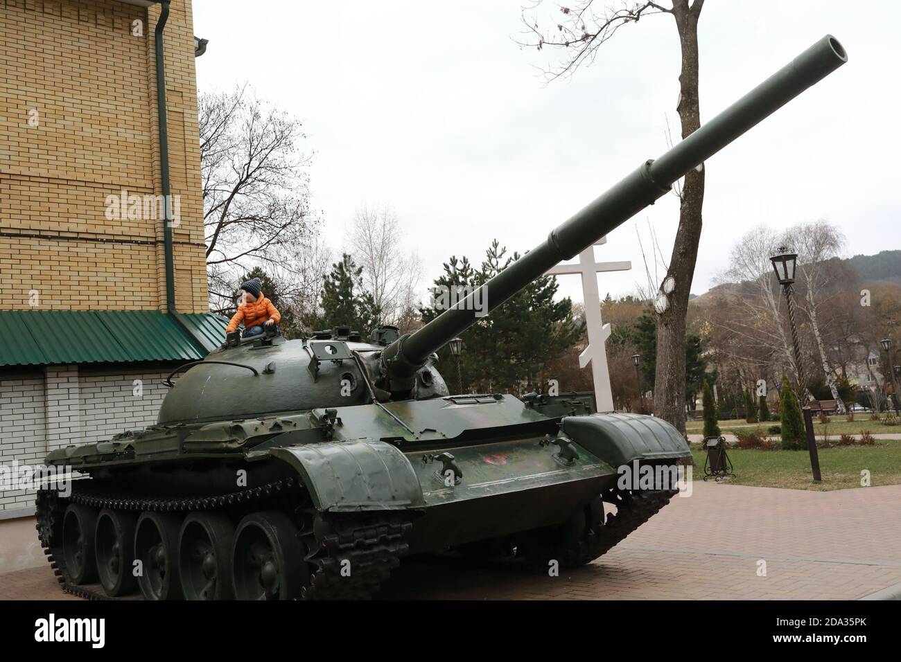Boy playing on Soviet main battle tank T-62, Kislovodsk, Russia Stock Photo