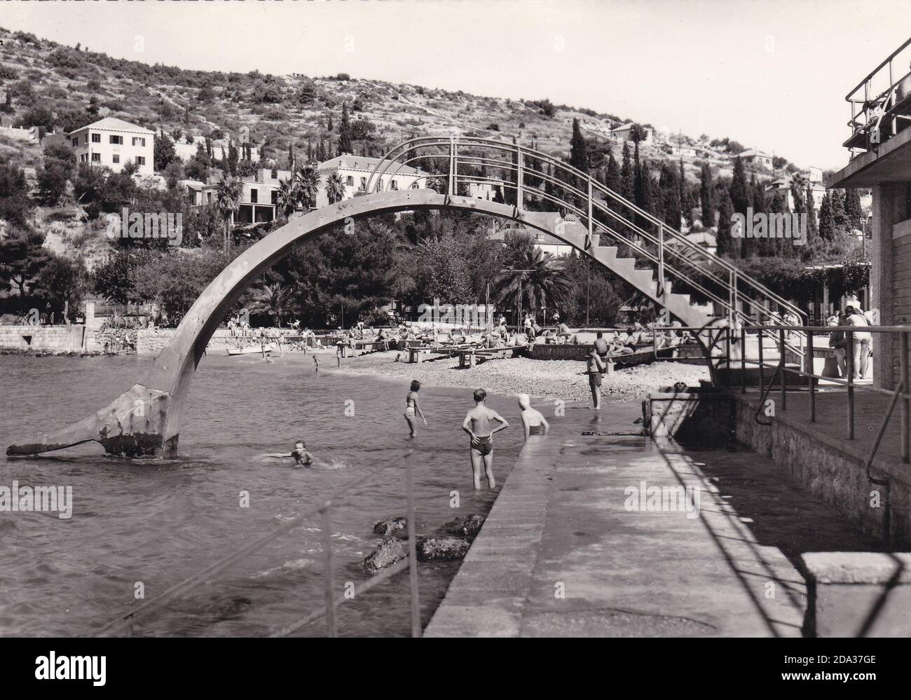Vintage black and white postcard of Split, Dubrovnik, people swimming 1960s. Stock Photo