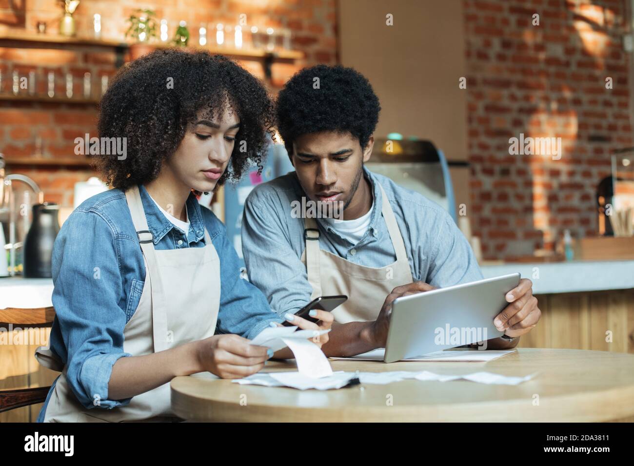Financial problems in city cafe during lockdown Stock Photo