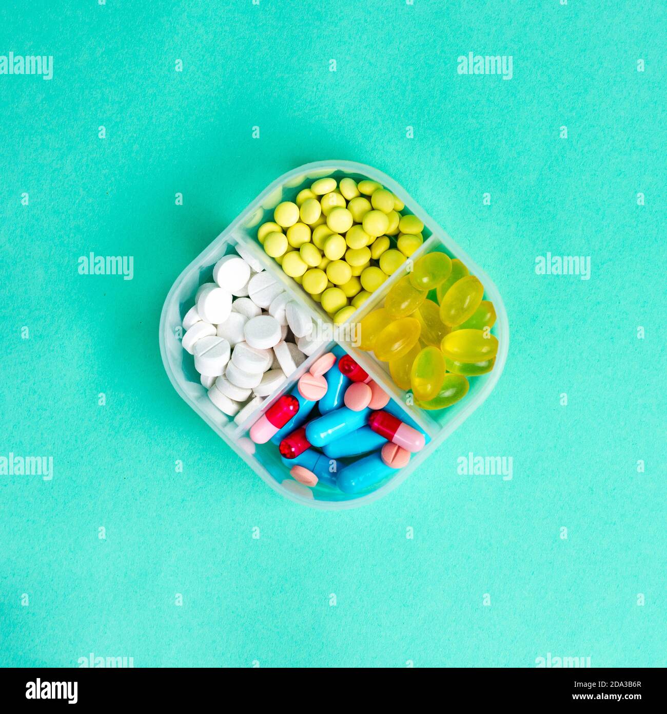 Medicines, medications in a pill box. Square format. View from above
