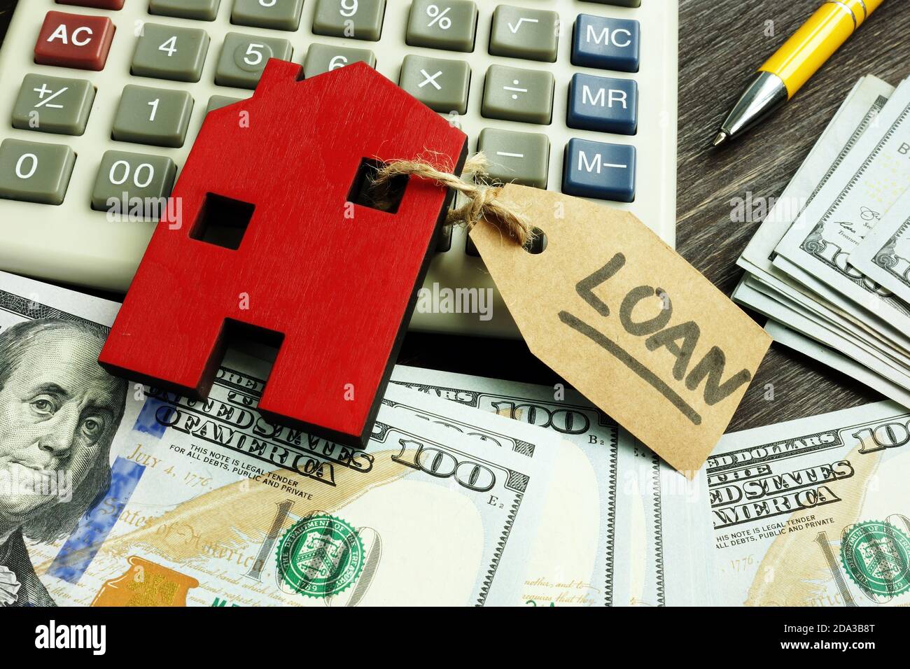 Money, home and label loan as symbol of mortgage. Stock Photo