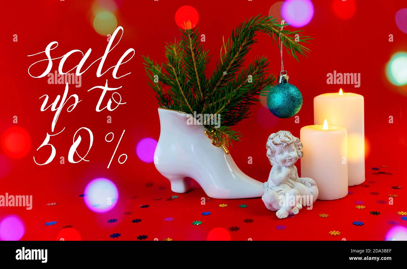 Internet banner, card, flyer about New Year, Christmas discounts, text -  sale up to 50, on a red background. bokeh effect Stock Photo