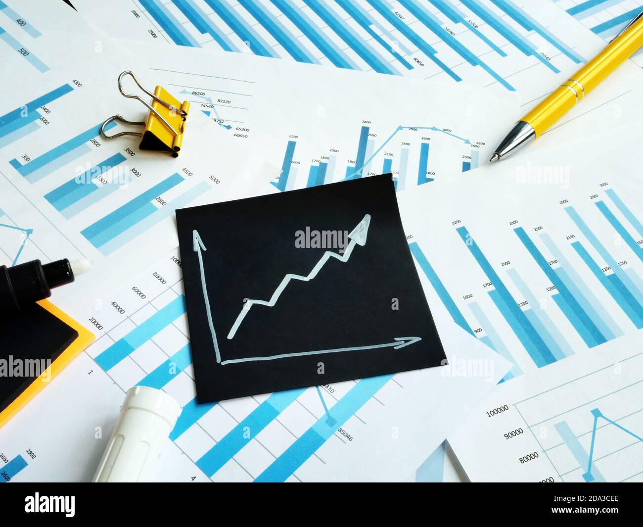 Rising arrow and charts. Business success and favorable business outlook. Profit increase concept. Stock Photo