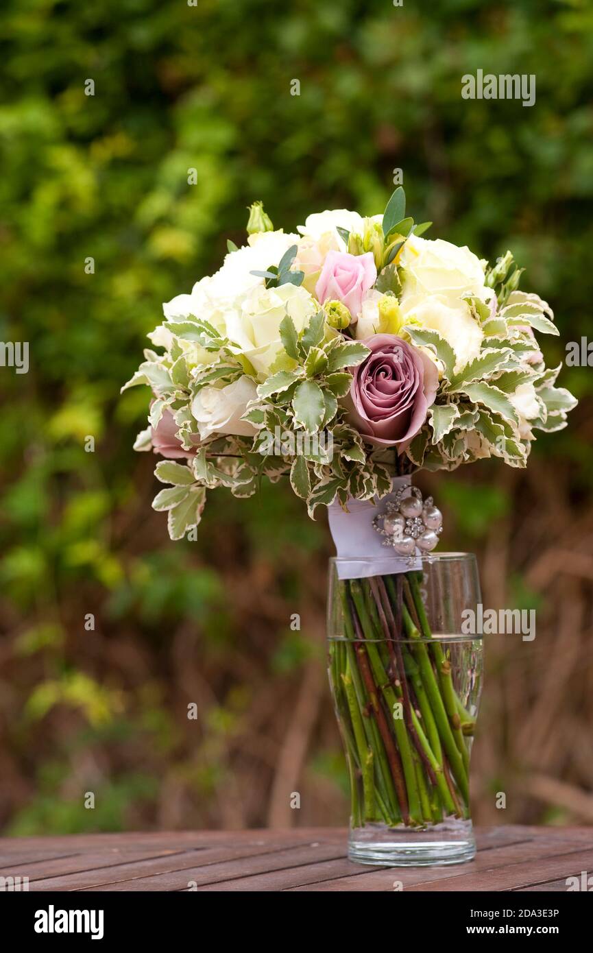 Bridal bouquet in a glass of water Stock Photo Alamy