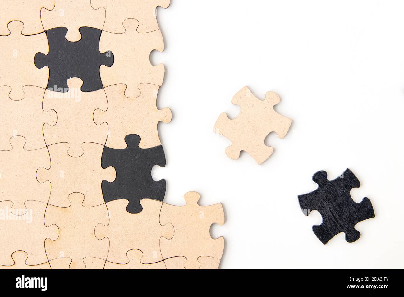 Wooden jigsaw puzzle pieces on a white background Stock Photo - Alamy