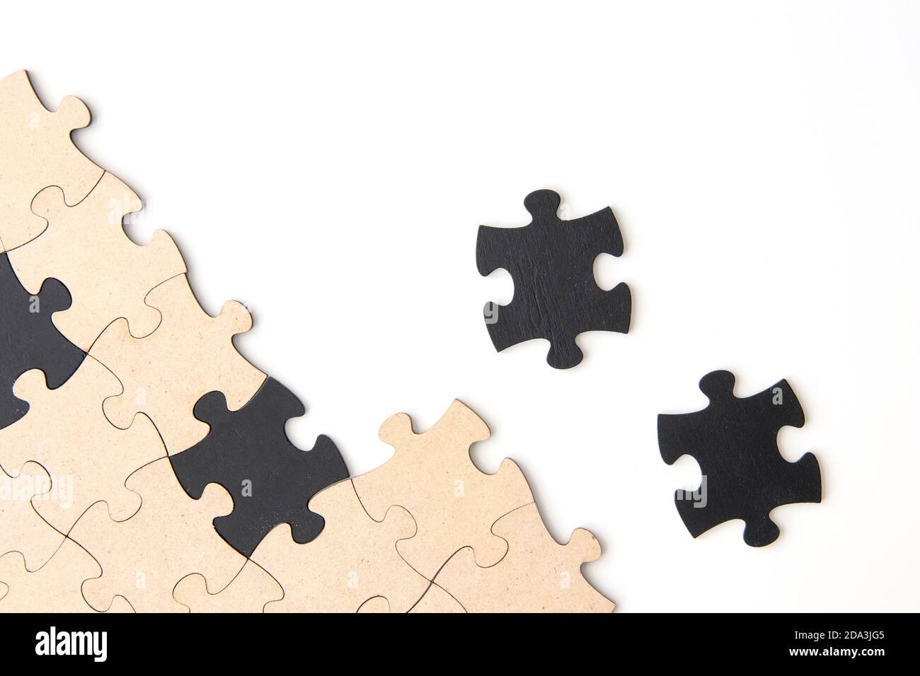 Wooden jigsaw puzzle pieces on a white background Stock Photo - Alamy