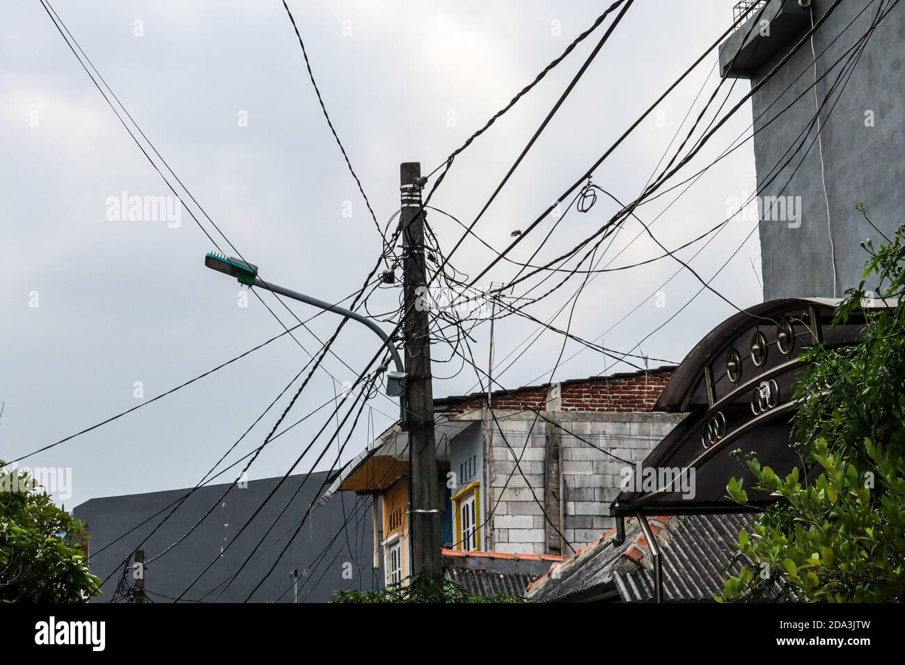 chaotic installation of electric cables and cables Stock Photo