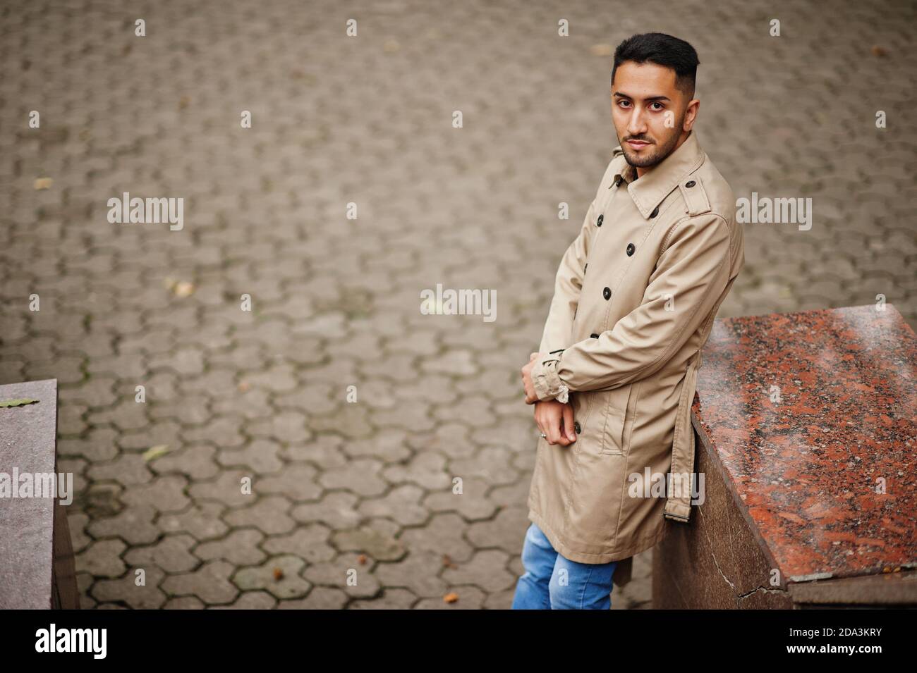 Stylish kuwaiti man at trench coat. Stock Photo