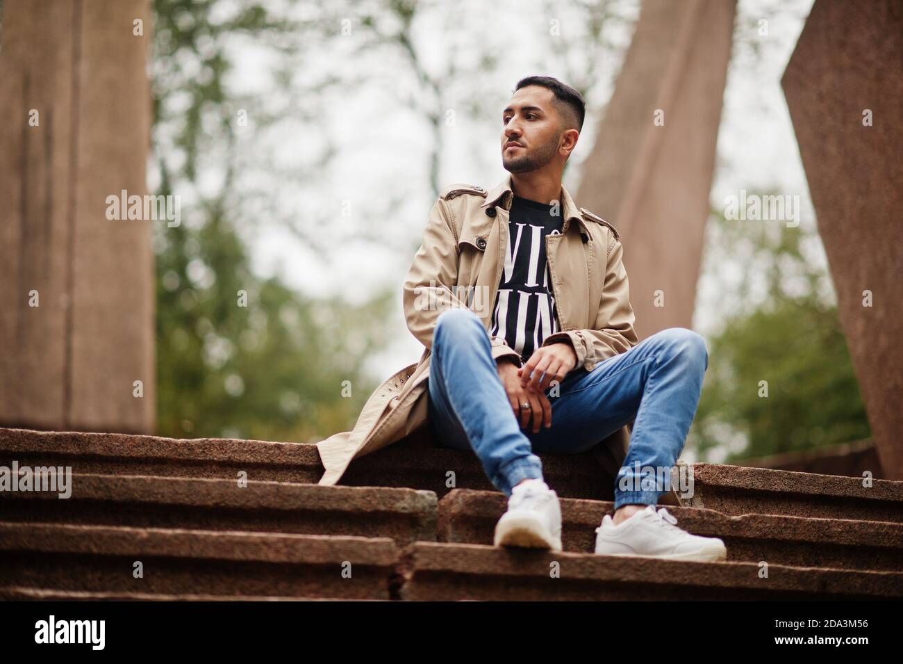 Stylish kuwaiti man at trench coat. Stock Photo