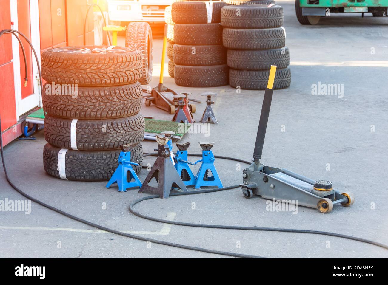 Jack for lifting a car body to replace tires on wheels Stock Photo