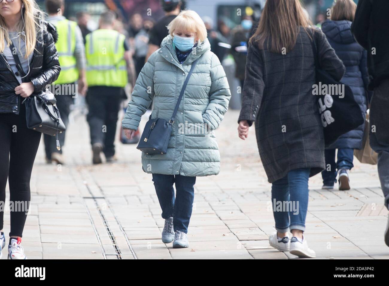 People out and about in Manchester City Centre whilst it was still under tier 2 lockdown restrictions. Stock Photo