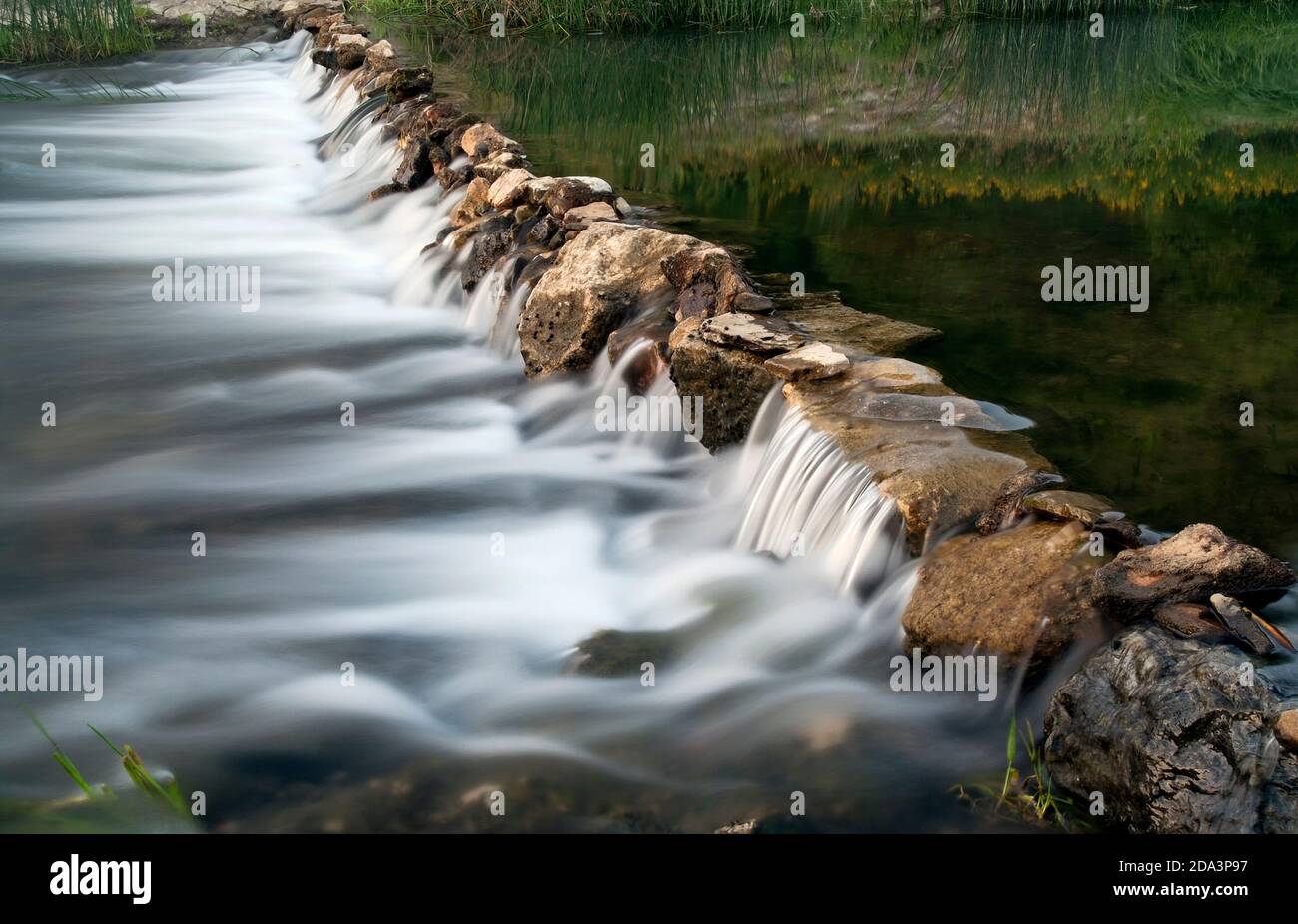 Cascade stream with motion blurred water of small river. Stock Photo