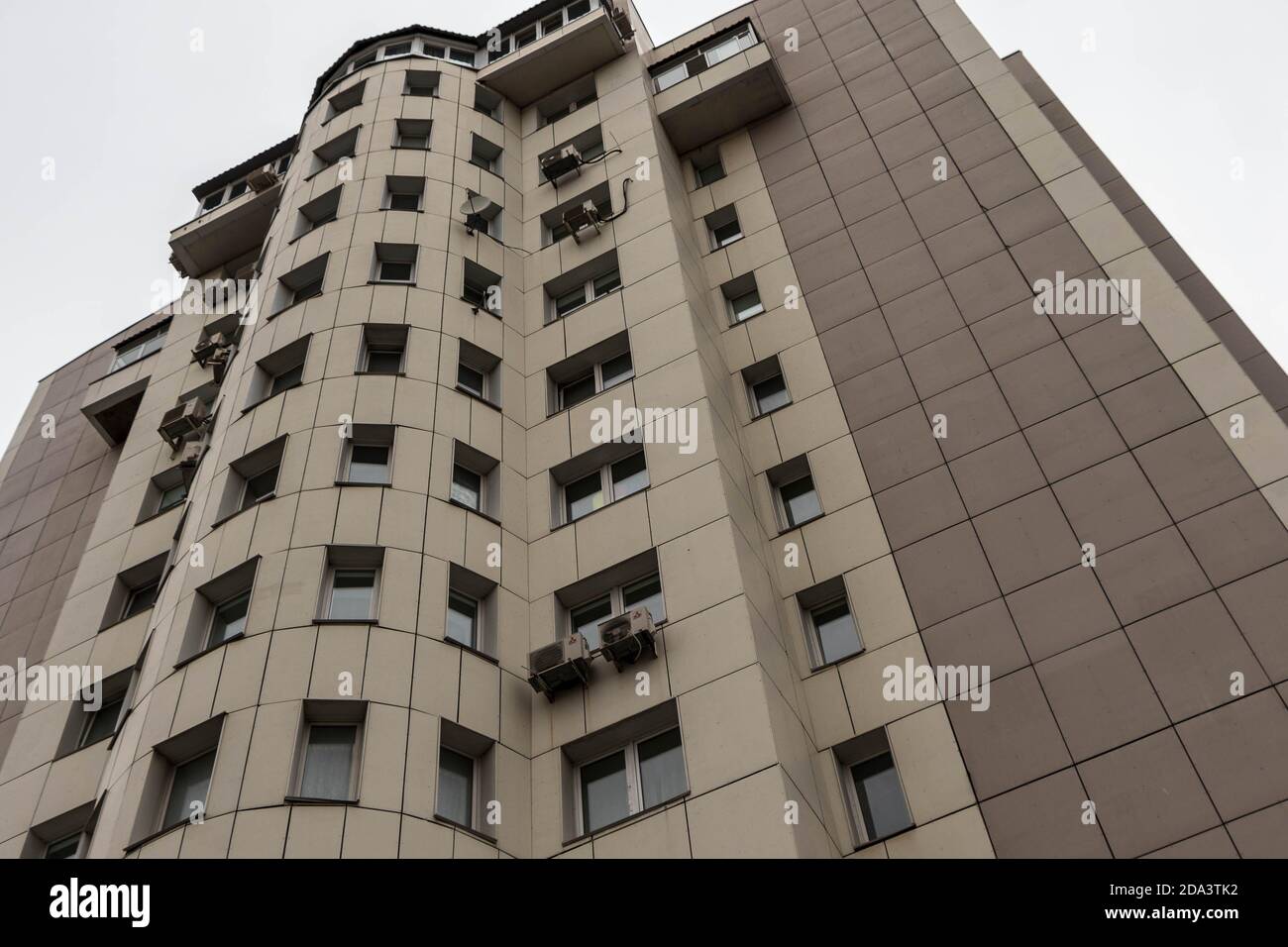 Urban architecture, a tall residential building against the sky. Stock Photo
